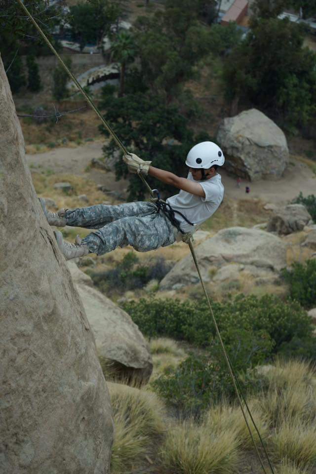 Explorer rappelling down a 90-foot cliff face at Stoney Point